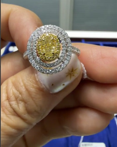 Oval Cut Yellow Diamond w White and Diamond Halo Ring